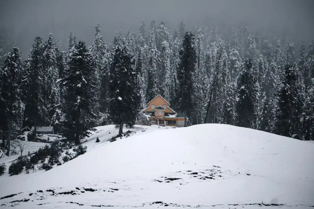 House in Mountains in Winter in Gulmurg India